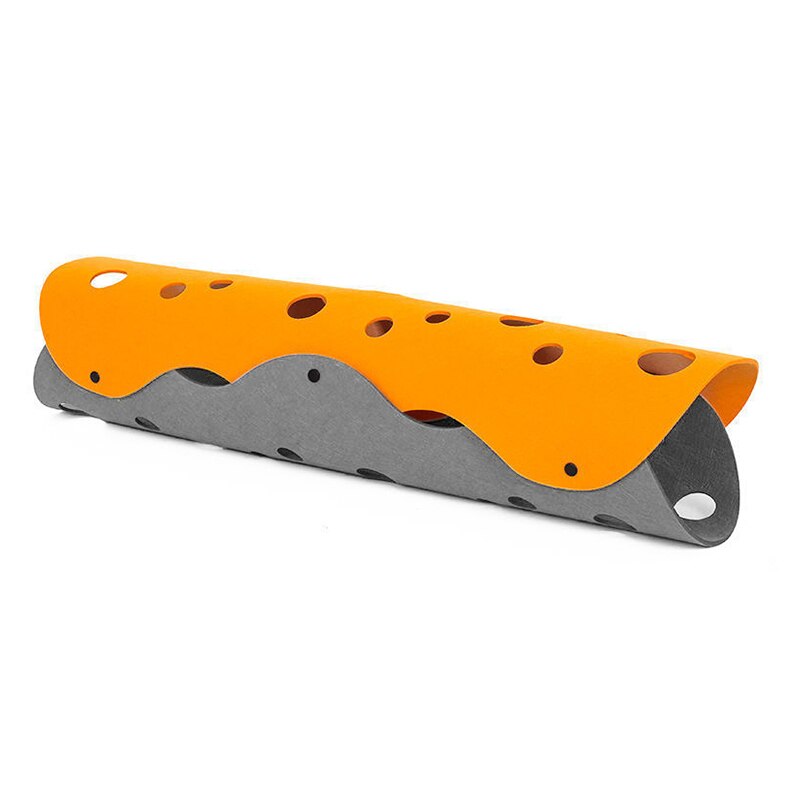 Orange and gray metal tool with multiple holes on a white background