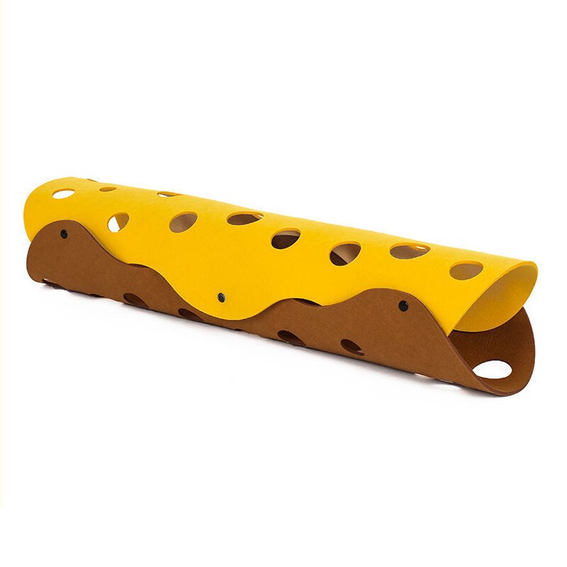 Yellow and brown plastic slide with holes on a white background